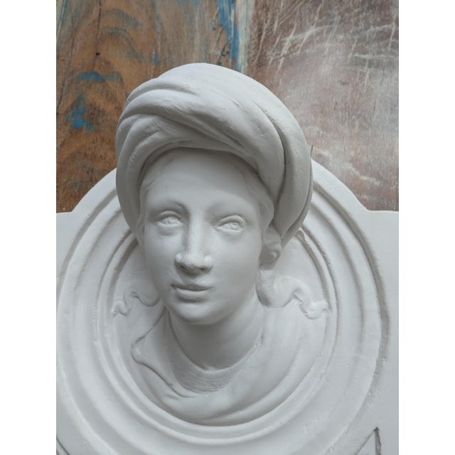 An exquisite and finely detailed architectural plaster cast plaque featuring the head of a prophet (traditionally...