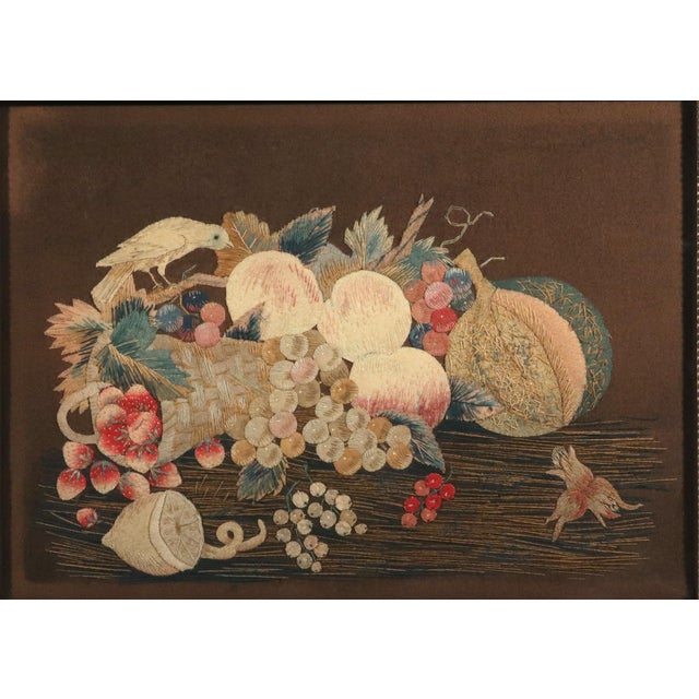 Regency Woolwork Still Life of Fruit with a Bird Circa 1830 A charming Regency woolwork picturing an abundant still life...