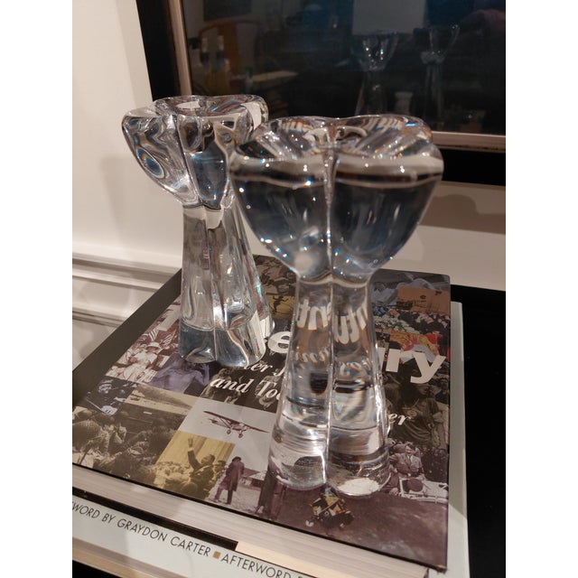 A striking pair of vintage Baccarat crystal candlesticks designed by noted French sculptor Robert Rigot. Each features a...
