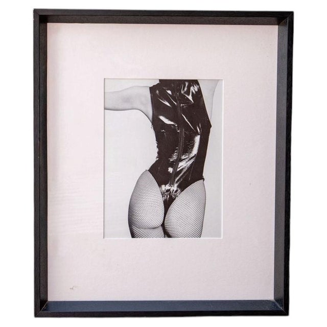 A striking fine duotone photo engraving by renowned British photographer John Swannell, titled Nude from Behind II,...