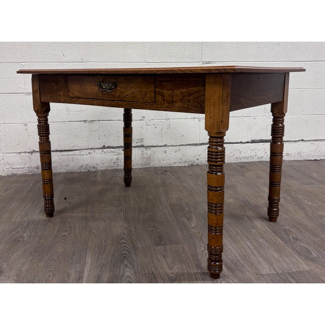 This is a stunning antique late 19th-century oak writing or work table featuring a beautifully grained rectangular top,...