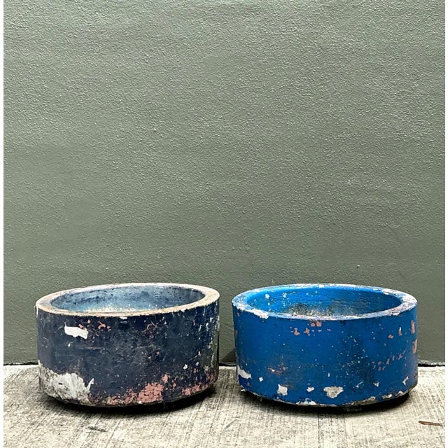 This charming pair of vintage cement planters embodies the timeless beauty of weathered garden décor, offering an...