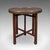 This is a vintage campaign tea table. A Middle Eastern, brass and beech Berber folding occasional table, dating to the Art...