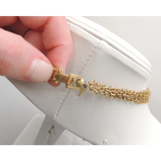 This is part of Chairish’s Costume Jewelry assortment. Circa 1960s faux-pade pendant drop with four bigger faux-jade drops...