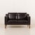 This high end elegant black leather sofa was produced by hurup in denmark in the 1980s. It is a refined example of late...