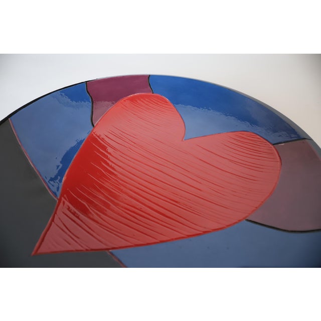 Beautiful hand painted multi color charger with large heart. Measuring seventeen inches in diameter, it makes for a great...