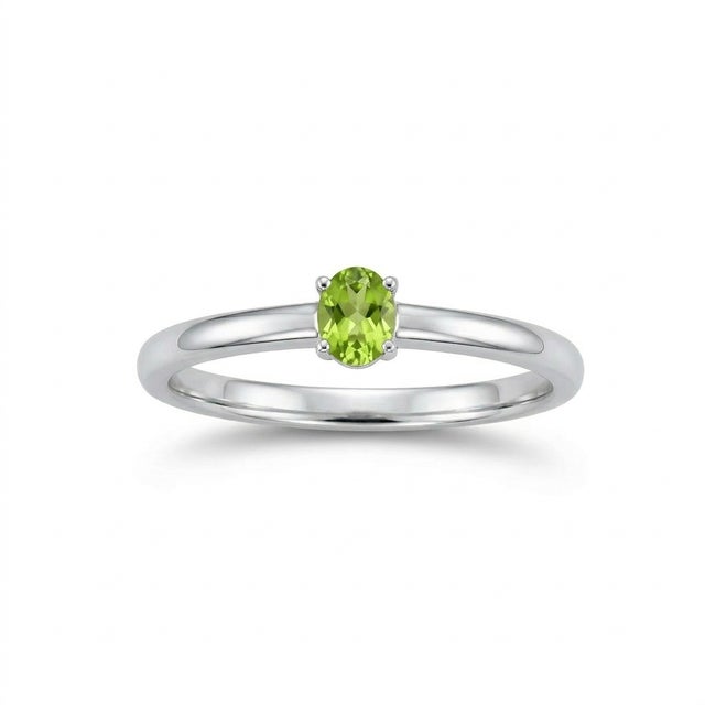 Professional Jewelry Description This elegant solitaire ring showcases a fresh and vibrant green gemstone, beautifully set...