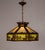 A detailed geometric umbrella-shaped slag glass pendant light fixture from the early 20th century. The slag glass is...