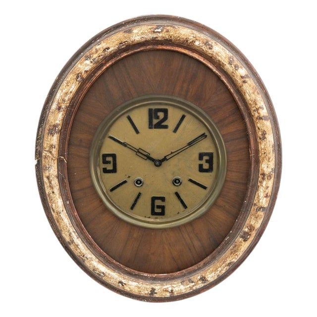 French Art Deco Oval Mahogany and Brass Wall Clock For Sale