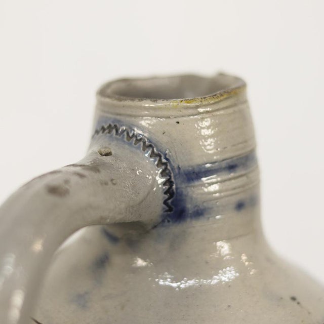 This beautiful decorative earthenware jug originates from Germany and dates from the late 19th century. The jug is...