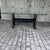 A bold, sculptural dining table in the Postmodern/Memphis-adjacent style popular in the 1980s. The rectangular glass top...