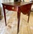 Beautifully constructed Pembroke table with a luminous base of figured mahogany. Single drawer with false drawer at...