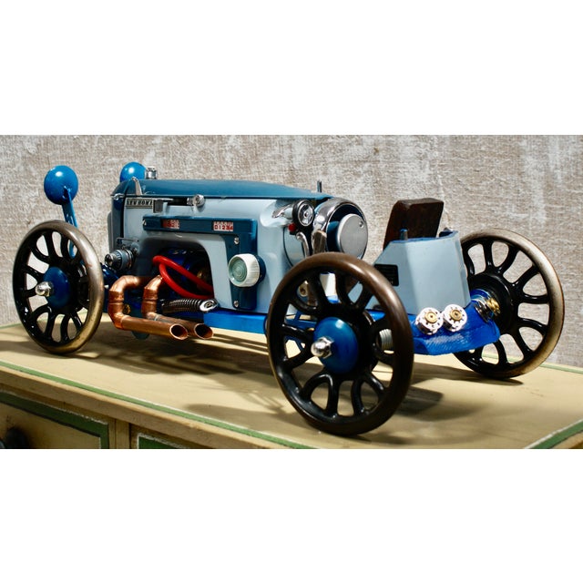 A fantastic custom steampunk sculpture. Completely made from sewing machine parts & industrial components, some still...