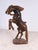 A decorative Italian Florentine carved wooden sculpture of a rearing horse, dating to around 1920. The figure is boldly...