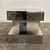 This is a post modern side table in the style of Paul Evans featuring a brushed metal and chrome body. This side table has...
