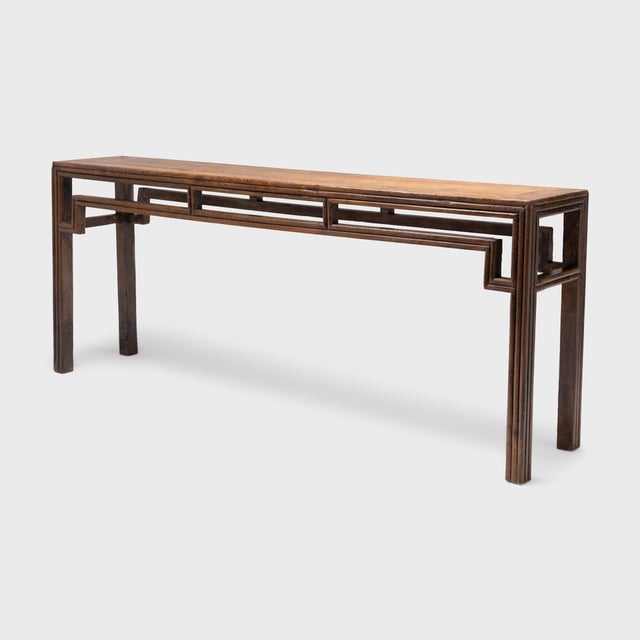 This long console table once resided in a 19th-century Chinese home, laden with food offerings and incense as a home altar...