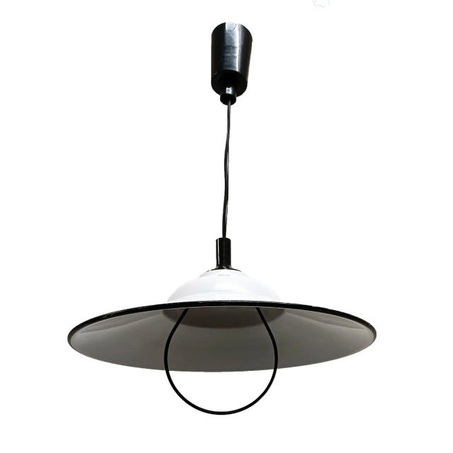 Roof lamp of the 70s with white metal screen and detail in black color. With adjustable height with pulley. You can remove...