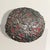 This oblong wooden sphere—lacquered in a sultry, oxblood red—has been entirely armored in silver metal ex-votos, each one...