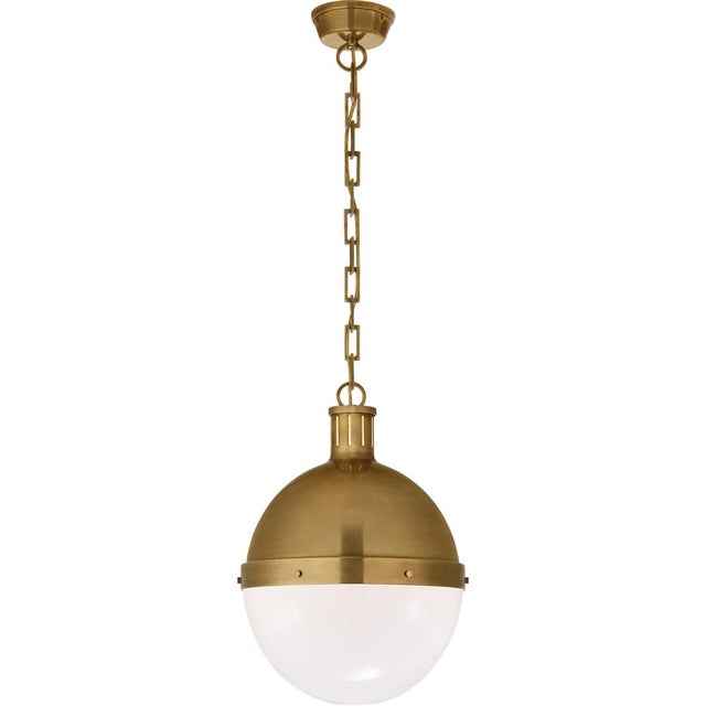 Hicks Large Pendant in Hand-Rubbed Antique Brass with White Glass Designer: Thomas O'Brien Canopy: 4.75" Round Mounting:...