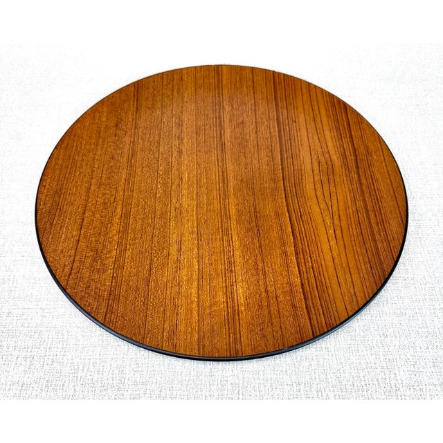 A warm and beautiful circa 1960’s teak and lacquer “Contempo” Otagiri Style round tray or charger (unsigned). Awesome teak...