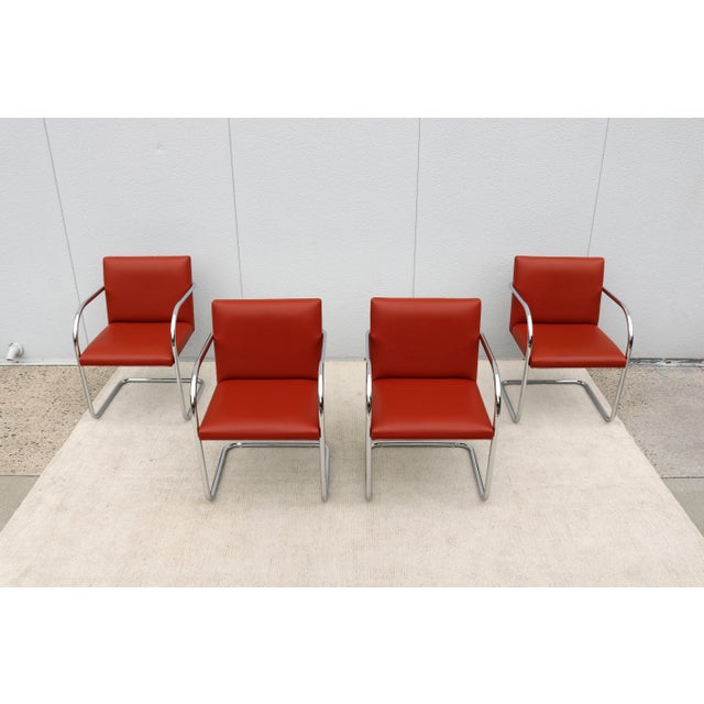 Fabulous set of 4 Brno tubular style chairs in vibrant mid-century orange-hued vinyl upholstery, by Gordon International....