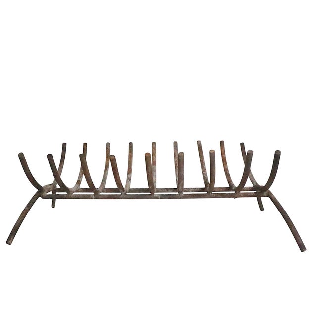 Nice mid century log holder, fireplace grate, having 9 repeating U shaped log holders, which are supported by opposing U...