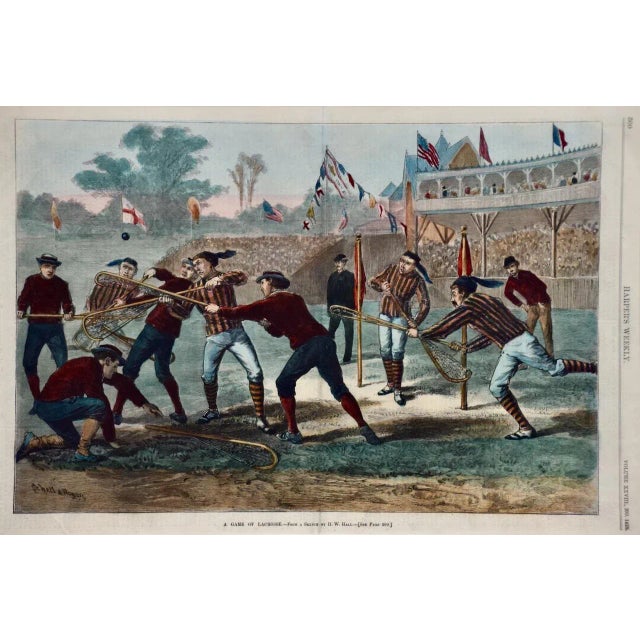 A colorful and attractive hand-colored 19th century woodcut engraving entitled "A Game of Lacrosse" after a drawing by W....