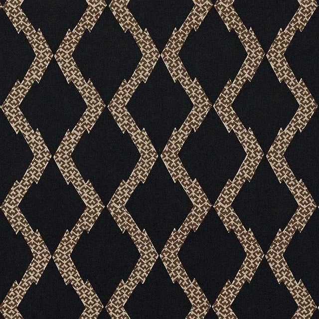 Combining two labor-intensive processes-applique and embroidery-this chicest of the chic design has just a dash of exotic...