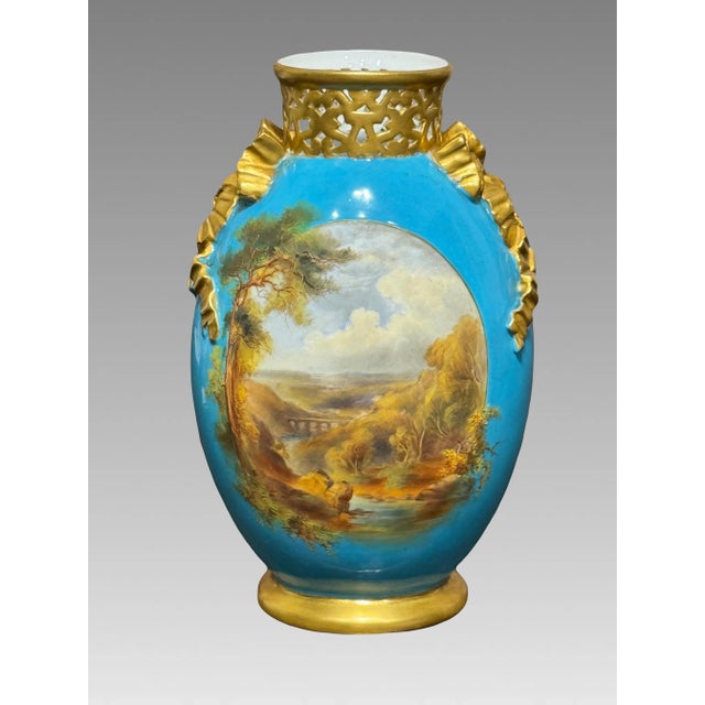 Stunning turquoise ground and rich gilt vase with reticulated neck with raised ribbon shoulders. When seen in person this...