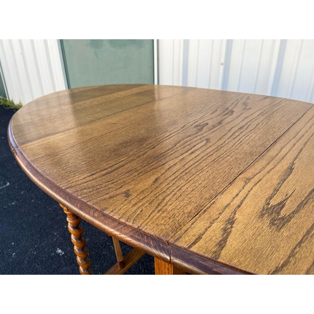 Early 1900's English Oak Barley Twist Oval Gate Leg Table For Sale - Image 11 of 12