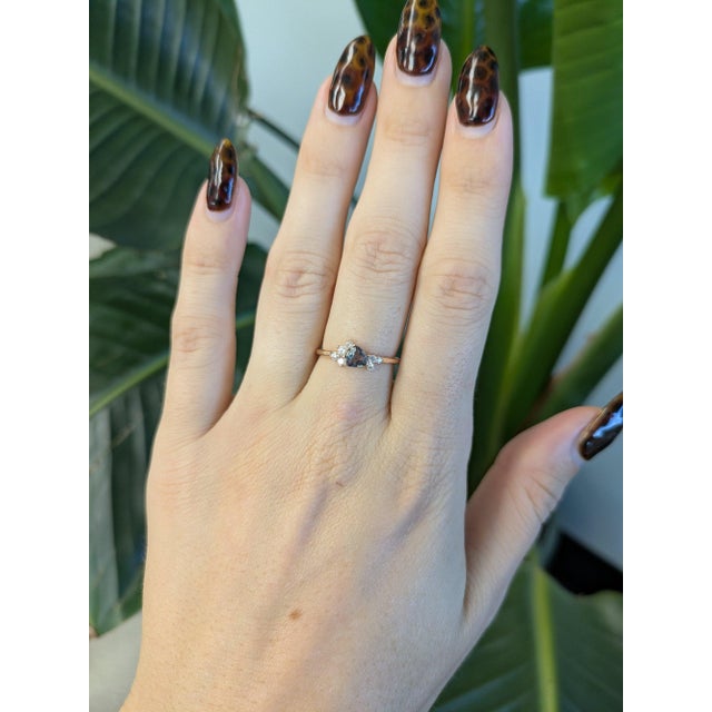 A 0.42ct alexandrite trillion ring set in solid 14K rose gold, set with seven earth mined diamonds. Alexandrite is famed...