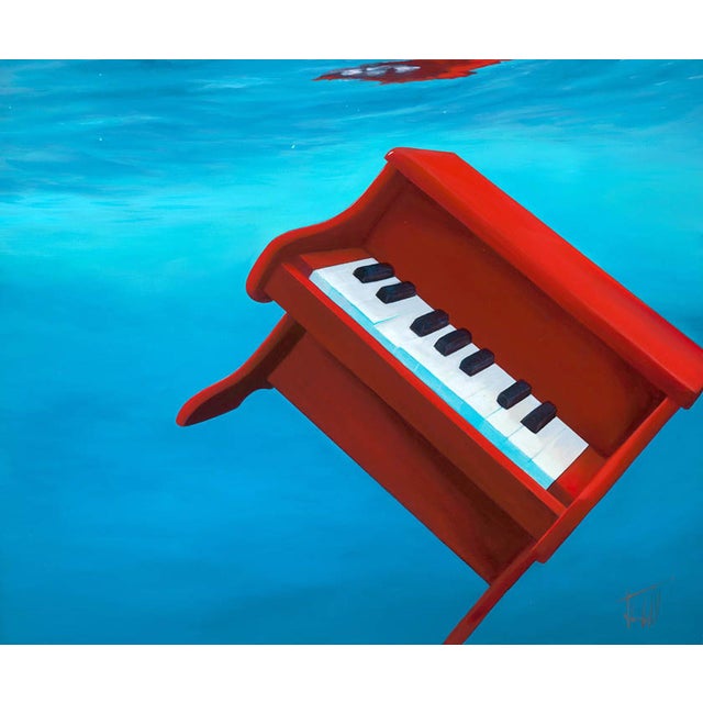 This artwork depicts a vibrant red piano partially submerged in tranquil blue waters, creating a striking contrast between...