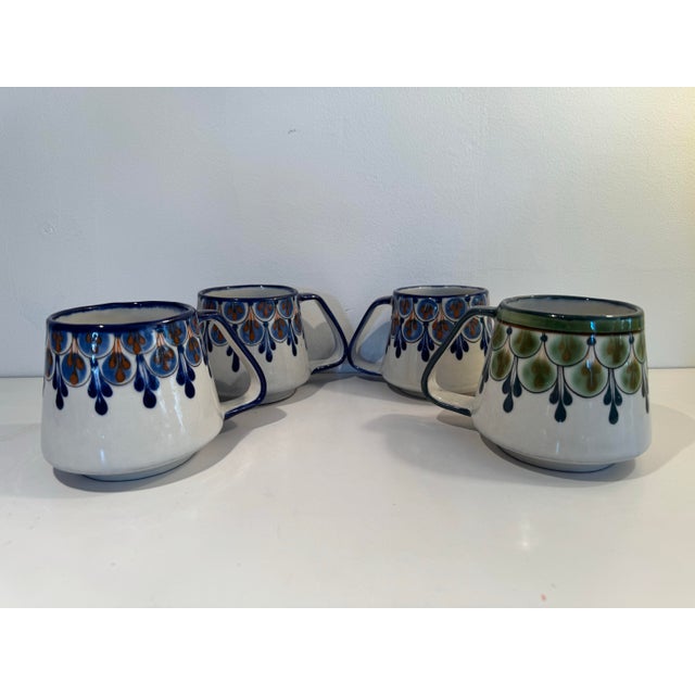 Beautiful set of 4 Ken Edwards mugs in great condition each. Please review photos and let me know if you have any...