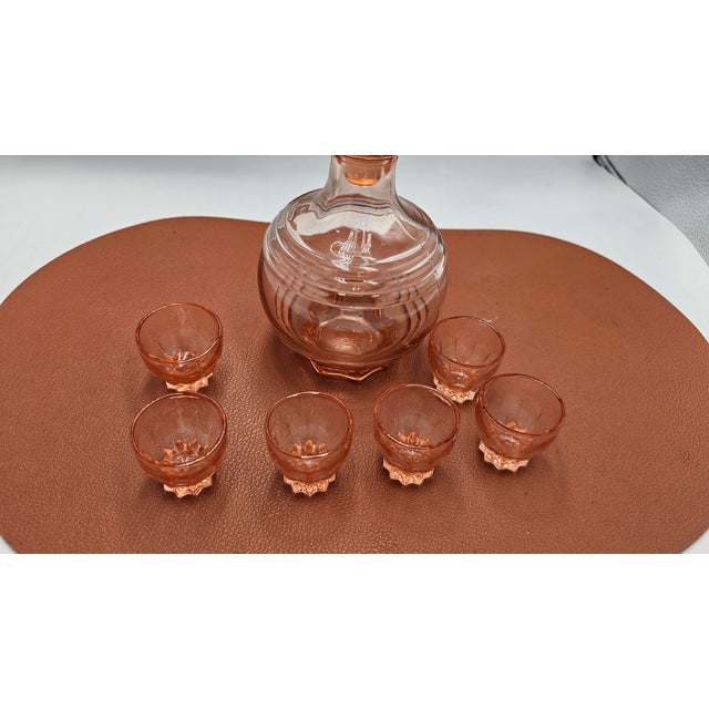 Glass decanter and 6 glasses, Rosalin pink, Art Deco, dimensions: height 15.5 cm, diameter at the widest point 10.3 cm....