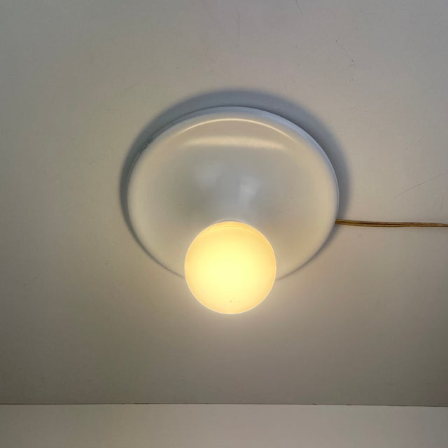 Italian space-age ceiling or wall lamp in white enameled metal from the 1970’s. - designed by: targetti sankey period:...