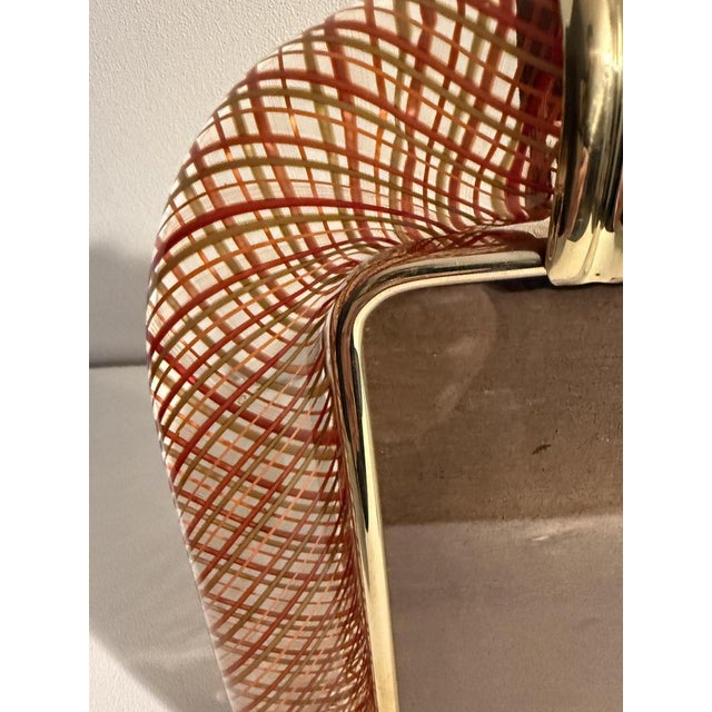 This beautiful vertical photo frame is purely in the tradition of Venetian glassmaking. The technique used to achieve this...