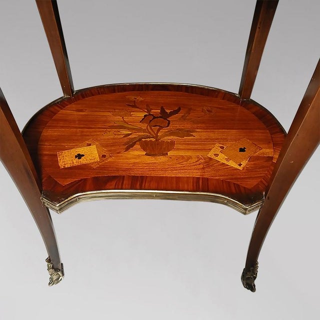 Small Louis XV style marquetry side table with a varnished finish. The top depicts a scene of Chinese figures. Small...