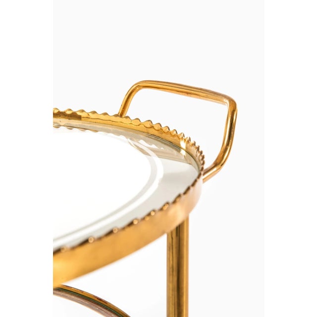 Midcentury trolley in brass and glass. Produced in Italy.