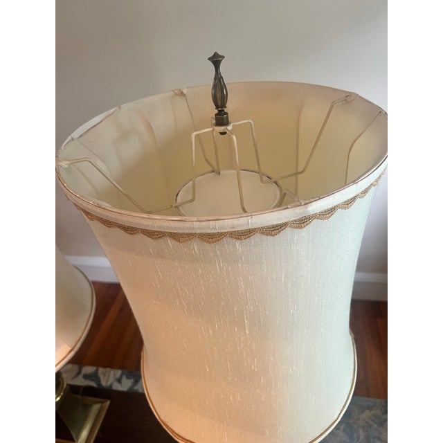 A stunning matched pair of Rembrandt Lamp Company torchiere table lamps in the Hollywood Regency style. Each lamp features...