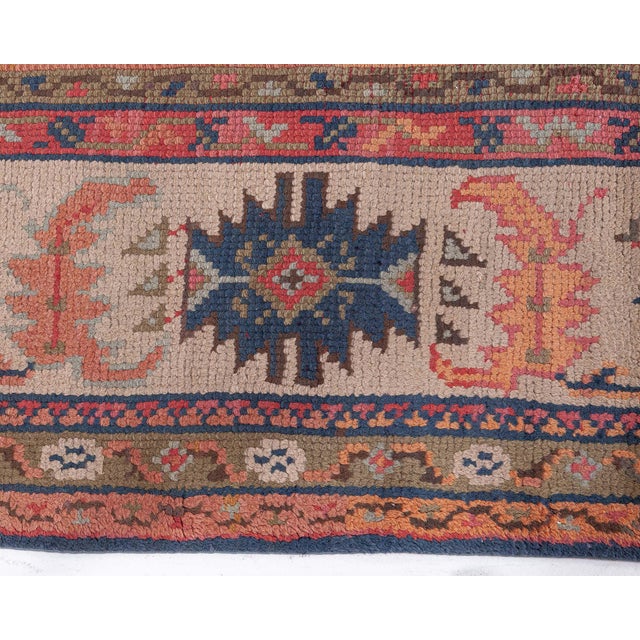 This exquisite early 20th-century Turkish Oushak rug (circa 1900) measures approximately 13 feet by 9 feet and exemplifies...