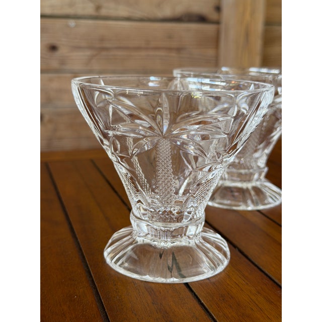 Bring a touch of the tropics to dessert hour with this charming set of four Godinger crystal ice cream bowls featuring an...