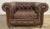 Vintage oversized English Style Chesterfield tufted leather club chair featuring rich tobacco brown tufted leather on back...