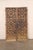 A Spanish pair of geometric panel motif carved wood doors from the 18th century. These antique doors from Spain have been...