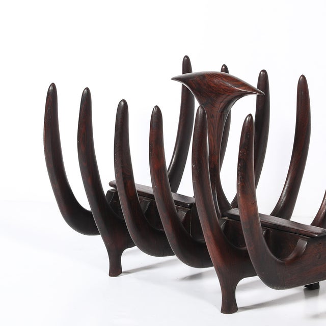 This Mid-Century Modernist magazine stand, crafted in Denmark circa 1960, is a bold yet refined example of Scandinavian...
