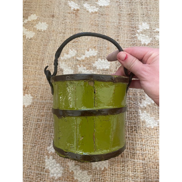 The Antique Primitive Wooden Forged Iron Rice Berry Bucket in green is a unique and charming piece that combines...
