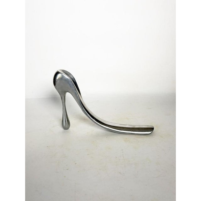 Sculptural shoehorn in polished aluminum, made in France circa 1970. This piece is distinguished by its bold silhouette,...