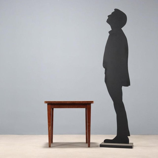 Coffee table, stained beech frame, mahogany veneered wood top. This piece is attributed to the mentioned designer/maker....