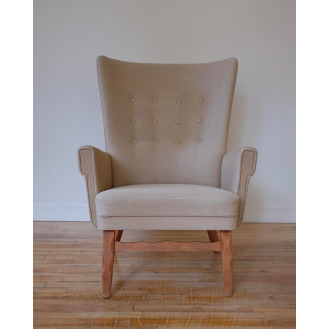 Danish Mid-Century Lounge Chair attributed to Henning Kjærnulf. Beautiful carved front legs and a nice curved back....