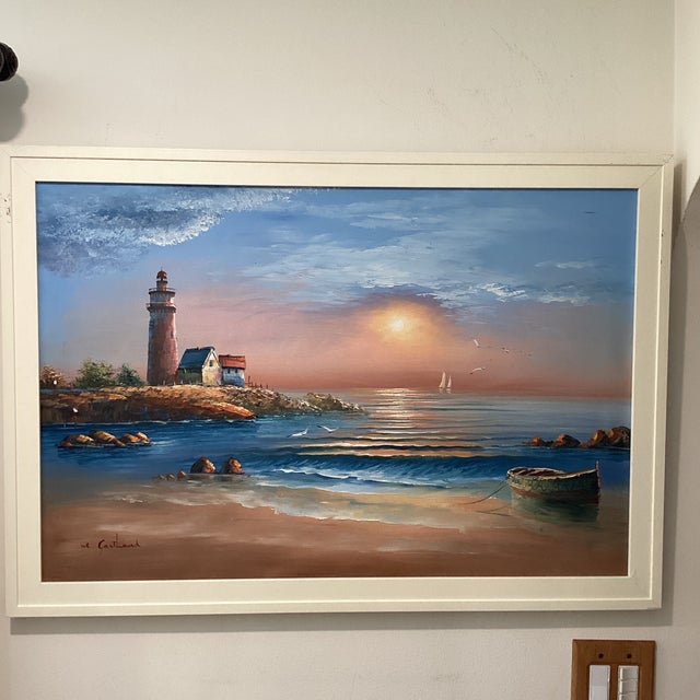 M. Gartland's Seascape Lighthouse Sunset on the Beach is an original oil painting on canvas, showcasing an impressionistic...