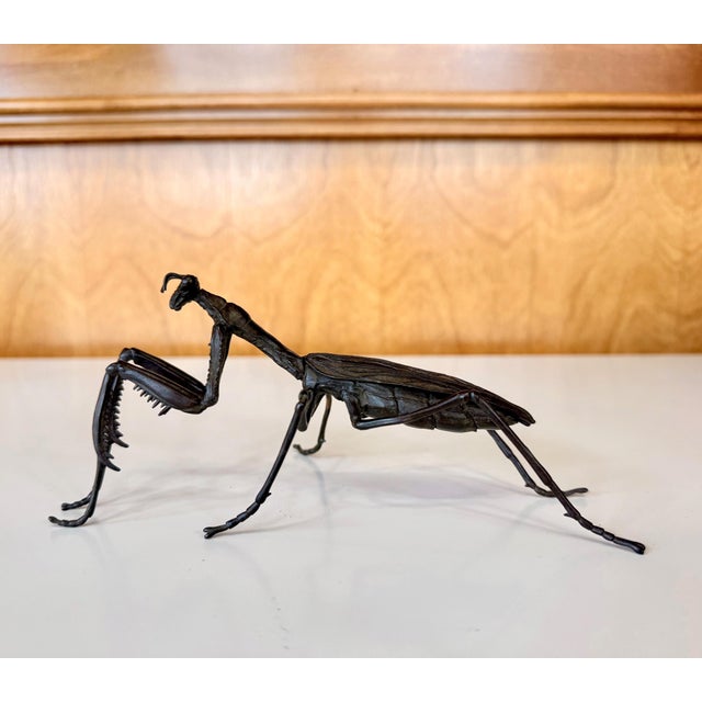 A bronze Japanese okimono cast in refined and realistic form of a praying mantis attributed to by Ryubundo Yasunosuke VI...